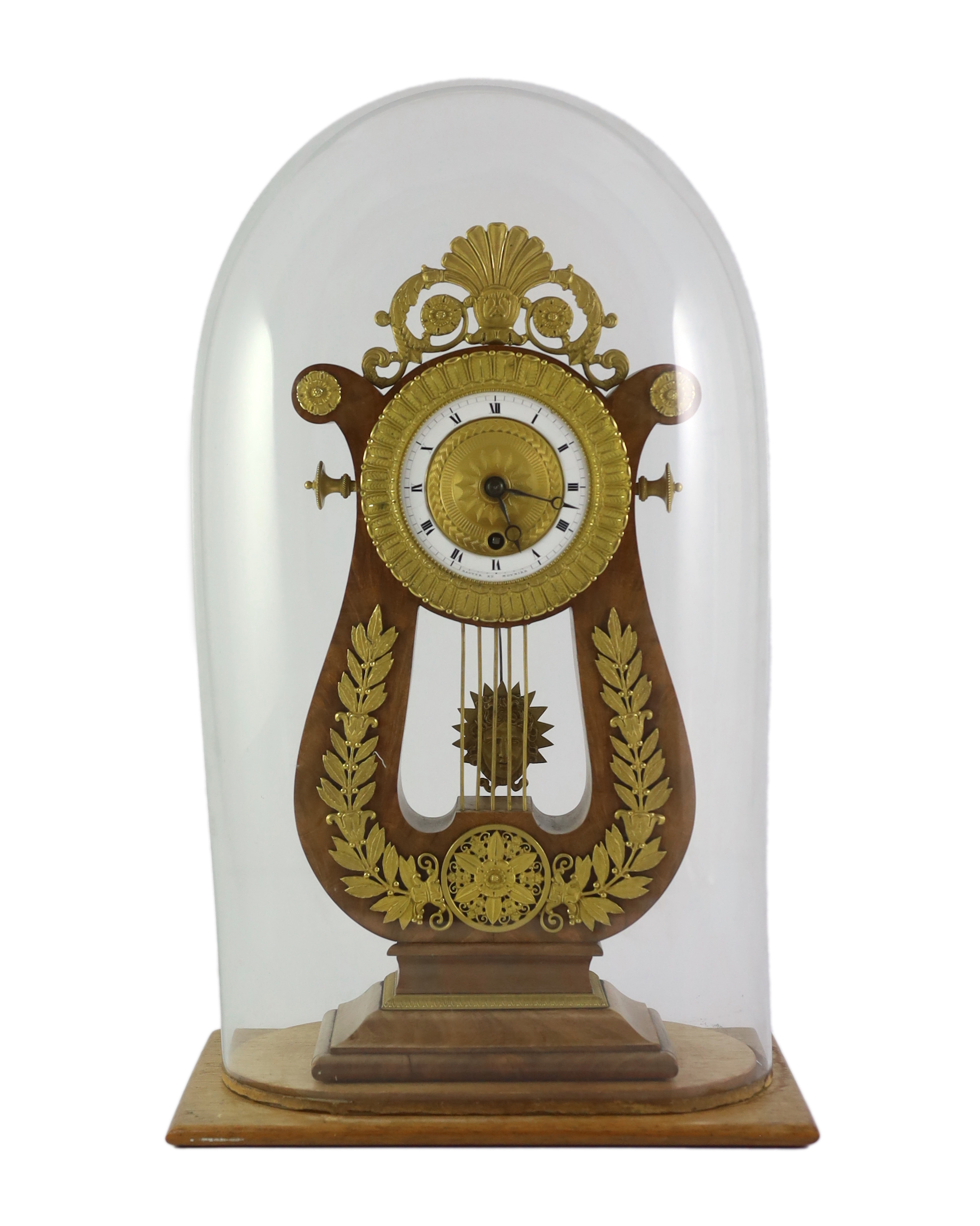 Bautte et Moynier. An early 19th century Swiss ormolu mounted mahogany lyre shaped mantel timepiece